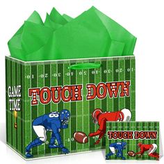 a football themed gift bag with tissue paper