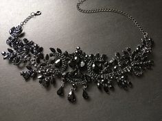 "This romantic and gothic style design wedding bridal choker necklace linked to cable chain finished with sparkle crystals at end for you to adjust the length. Size: necklace measures around 14.5\" long x center drop 3.1\" Color: dark silver with black rhinestone crystals and glass stones Item ship out with tracking number to you (around 10 to 14 business days for delivery). We also provide fast shipping service, around 3-4 business days delivery but need to add extra charge. Please convo us if Luxury Black Spinel Jewelry For Evening, Elegant Black Rhinestone Necklace For Wedding, Black Glamorous Formal Jewelry, Glamorous Black Formal Jewelry, Black Glamorous Jewelry For Formal Occasions, Elegant Black Bridal Necklace For Formal Occasions, Elegant Black Wedding Choker, Elegant Black Formal Choker, Elegant Black Choker For Wedding