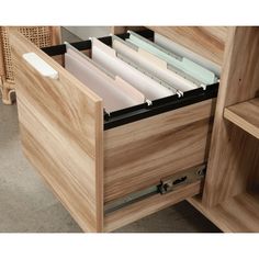 an open drawer with files and folders in it