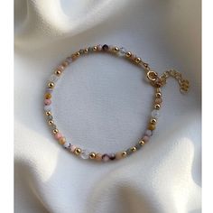 Delicate Peruvian pink opal, moonstone and labradorite bracelet made with 14kt gold filled beads. Individually selected high quality gemstones make the bracelet truly special and one of a kind. The delicate and minimalist design goes well with both casual and sophisticated looks. You can layer the bracelet or wear it by itself. Size of the gemstones is approx. 3mm Bracelet has 1 inch chain extender. PINK OPAL: it intensifies emotions and releases inhibitions helping to express one's true self. E Dainty 14k Gold-filled Bracelets With Colorful Beads, Gold Rose Quartz Bracelets For Jewelry Making, Gold Opal Jewelry With Round Beads, Adjustable Pink Opal Gemstone Jewelry, Delicate Beaded 14k Gold-filled Bracelets, Pink Opal Bracelet Jewelry, Adjustable Pink Opal Bracelet, Adjustable Opal Round Bracelets, Adjustable Round Opal Bracelets