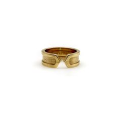 This is part of Chairish's Fine Jewelry Collection.  This 18k gold ring is a play on the classic double-c Cartier design. An abstracted c raises up as an exterior border that continues around the band. Two c’s back up against each other, meeting at a sharp point in the middle of the ring for a clean, modern look.  The outside border has a high polish, while the interior layer has a brushed gold finish. The design is subtle and simplistic, and the ring makes for an excellent staple in any jewelry Timeless 14k Gold Wide Band Ring With Open Band, Timeless 14k Gold Wide Band Ring With Open Design, Timeless Wide Band Open Ring In 14k Gold, Timeless Wide Band 14k Gold Open Ring, Luxury Engraved Wide Band Ring In Yellow Gold, Luxury Yellow Gold Wide Band Engraved Ring, Luxury Wide Band Engraved Yellow Gold Ring, Classic Rings With Decorative Open Band, Timeless Wide Band Open Ring