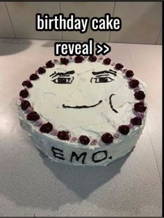 a birthday cake with an emo face on it's side and the caption reads, birthday cake reveal