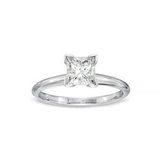 a princess cut diamond engagement ring on a white background, with the center stone visible