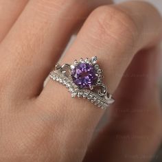 * The delicate ring displays amethyst as main stone. The curved band beneath the gemstone makes the ring like an elegant crown. For who wearing this dainty ring, will shine like a queen. ◆ Production Description: Main stone Type: Amethyst Main Stone Shape: Round Cut Main Stone Size: 7*7mm Side stone: CZ Metal: 925 Sterling silver - Other options available in the drop down menu ◆ Customization: √Free for Add Engraving √Other Metal Type Available √Other Gemstones & Shapes Available √Personaliz Purple And Silver Wedding Ring, Purple Quince Ring, Elegant Amethyst Birthstone Diamond Ring, Elegant Purple Birthstone Ring With Round Cut, Elegant Amethyst Birthstone Crystal Ring, Elegant Purple Round Cut Birthstone Ring, Elegant Purple Birthstone Promise Ring, Elegant Amethyst Birthstone Ring With Prong Setting, Elegant Amethyst Birthstone Ring For Promise