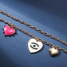 Feel the love with our Evil Eye Heart Bracelet. Crafted with a singular focus, this bracelet offers an exquisitely-crafted representation of protection and love, alluringly adorned with a delightful heart bearing an eye at its center. Ensuring that the wearer is blessed by the all-seeing eye of affection, this luxurious piece is sure to captivate and enchant. Detail Plating: 18K Gold Materials: 18K Gold on Alloy Size:  Length:6.69 "(17cm)+Extender: 2.17"(5.5cm ) Weight: 17.9g Symbolic Jewelry For Promise On Valentine's Day, Symbolic Jewelry With Heart Charm For Gift, Symbolic Heart Charm Jewelry As Gift, Symbolic Promise Jewelry For Valentine's Day, Gold Promise Bracelets With Heart Charm, Heart Shaped Tarnish Resistant Bracelet For Gift, Metal Bracelet With Heart Charm As Gift, Gold Heart Bracelet With Heart Charm For Promise, Valentine's Day Symbolic Jewelry With Heart Charm