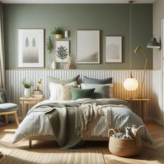 a bedroom with green walls and pictures on the wall