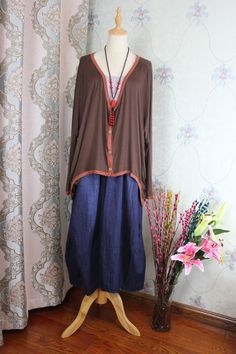 "【Fabric】 cotton 【Color】 dark brown 【Size】 Shoulder width is not limited Shoulder + sleeve length 72cm/ 28 \" Bust 160cm/ 62 \" Length 57-80cm/ 22-31 \" Washing & Care instructions: -Hand wash or gently machine washable do not tumble dry -Gentle wash cycle (40oC) -If you feel like ironing (although should not be necessary) , do it with steam or while the dress is still slightly wet -Do not bleach If you like this dress, perhaps you will also like other dresses from our collection. Be sure to Oversized Bohemian Long Sleeve Blouse, Dark Brown Blouse, Oversize Blouse, Bat Shirt, Knitted Shirt, Beige Blouse, Purple Maxi Dress, Linen Fashion, Oversized Blouse