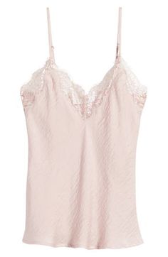 Lace trims the neckline of this drapey camisole made from sleek satin. 22" length V-neck Adjustable straps 100% polyester Hand wash, line dry Imported V-neck Satin Camisole With Lace Trim, V-neck Camisole With Delicate Straps For Night Out, Satin Tank Top With Built-in Bra, Elegant Pink Camisole With Built-in Bra, Silk Cami Tank Top With Built-in Bra, Feminine Tank Top With Spaghetti Straps And Built-in Bra, Silk Camisole With Built-in Bra And Spaghetti Straps, Silk Camisole With Built-in Bra, Feminine Lace Trim Spaghetti Strap Camisole