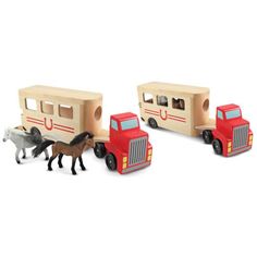 three toy trucks with horses attached to them