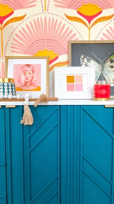 a blue cabinet with some pictures on it