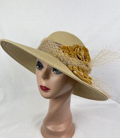 This one of a kind Tan 4 inch brim Toyo Straw hat is trimmed with 3 handmade gold velvet flowers, feathers, organza ribbon band with bow and removable gold netting. The hat will fit 22- 22 5/8 inch head sizes with a sizing cord inside the band to adjust to your head size. NOTE: Please check the head size before purchase, I am happy to answer any questions you may have. There will be a 20% restocking fee for all returned hats. Gold Brimmed Straw Hat, Handmade Gold Hat For Kentucky Derby, Gold Wide-brim Straw Hat For Kentucky Derby, Gold Wide Brim Straw Hat For Kentucky Derby, Gold Flat Brim Hat Bands For Kentucky Derby, Gold Brimmed Straw Hat For Kentucky Derby, Gold Flat Brim Sun Hat For Kentucky Derby, Gold Straw Hat With Flat Brim, Gold Curved Brim Costume Hat For Summer