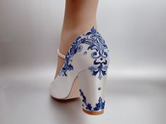 🌸 Inspired by Blue & White china/porcelain 🌸 Elegant Leaves & Branches Pattern Design 🌸 Black Version Link: 🔗 https://www.etsy.com/listing/1716749244 🌸 Shoes in Photos: Type A-Deluxe Version: Whole Shoe Embellished Type B-Simple Version: Front Embellished Type C-Elegant Version: Rear Embellished Type D-Asymmetry Version: Combine B & C Version (One Front & One Rear) 🍀 Ivory/White Satin Upper (can change to any other-colored satin for free) 🍀 Dark & Light Blue Combined Lace Applique 🍀 Heel height 7cm (approximately 2.8 inches) 🍀 Mary Jane Closed Toe 🍀 Block heels 🍀 Ankle strap can be removed upon request 🌸 Size Guide: 🍀 True to size (European size) 🍀 All shoes are made in standard width. 🍀 We are based in the US, but our shoes are made in European size, below is the conversion Blue Wedding Boots For Bride, Blue And White Shoes, Bridal Block Heels, Closed Toe Block Heels, Royalty Dr, Comfortable Wedding Shoes, Dream Wedding Shoes, Blue Block Heels, Off White Wedding