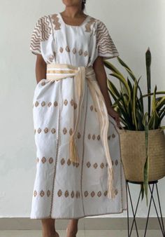 PRE ORDER!! This beatiful Mexican huipil (Mexican kaftan, or tunic) is made by Oaxaca artisan weaver in a very remote village in San Pedro de Amuzgos and pinacoteca (10 hours away from Oaxaca city). The huipil is made of organic cotton dyed with natural dyes all decorated by hand embroidered designs and  made in very ancient telar loom, hours and hours of work to have this beautiful piece of art! This unique huipil dress gives you an espectacular boho style cool and light to wear. Color: white Traditional White Handwoven Dress, Summer Maxi Kaftan For Traditional Ceremonies, Embroidered Beige Bohemian Kaftan, Folk Style Kaftan With Woven Motifs For Vacation, Spring Bohemian Kaftan For Traditional Ceremonies, Embroidered Cream Kaftan For Summer, Folk Style Woven Motifs Kaftan For Vacation, Traditional White Kaftan For Spring, Cream Embroidered Kaftan For Summer