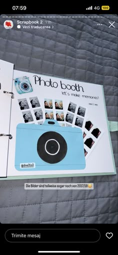 an open photo book on a bed with the cover pulled down to show pictures and text