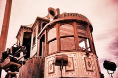 an old train car sitting on the tracks