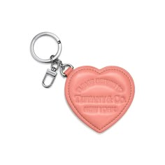 Inspired by one of the House’s most distinctive designs, the heart-shaped Return to Tiffany® bag charms are crafted with supple leather details that nod to our iconic jewelry. This bag charm features a split ring for your keys and a snap clip to add it to any Return to Tiffany® bag. Almond pink smooth lambskin leather and palladium-plated hardware; 0.3" H x 3.3" L x 3.2" W | Return to Tiffany® Padded Bag Charm in Almond Pink Leather Tiffany Bag, Iconic Jewelry, Padded Bag, Return To Tiffany, Pink Charm, Pad Bag, Birthday Inspo, Snap Clips, Bag Charms