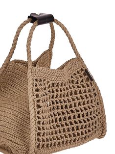 a crocheted handbag is shown on a white background with a black handle