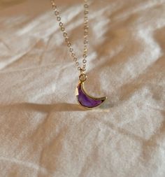 *PRODUCT DETAIL* ✧ Moon shaped natural amethyst gemstone necklace ✧ Available in gold filled chain. ✧ Pendant : 13mm, Gold plated *LINK TO ADD ON OPTIONS* ✧ Add initial pendants https://www.etsy.com/listing/1252771291/custom-initial-gemstone-necklace ✧ Additional chain for layered look https://www.etsy.com/listing/758611773/simple-gold-chain-dainty-chain-necklace *CRESCENT GEMSTONE OPTIONS* -GARNET (January birthstone) -AMETHYST (February birthstone) -AQUAMARINE (March Birthstone) -EMERALD (May Crescent Amulet Necklace As A Gift, Lavender Necklaces With Natural Stones For Gift, Crescent Amulet Necklace As Gift, Purple Necklace With Adjustable Chain For Gift, Purple Round Crystal Necklace As A Gift, Purple Amethyst Necklace For Gift, Crescent Birthstone Necklace For Gift, Crescent Birthstone Necklace Gift, Purple Birthstone Necklace With Round Pendant As Gift