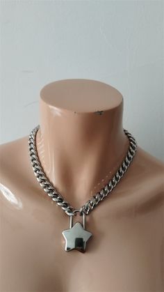 The product is a combination of stainless steel chains and alloy hearts. The length of the necklace on the model is 16 inches. If you need other lengths, please write to customize other lengths. The width of the necklace is 11mm, approximately 4.33 inches. You can also write to inquire about the width you need. Cuban Link Silver Chain Necklace, Silver Choker Necklace With Curb Chain, Silver Stainless Steel Choker Necklace, Silver Curb Chain Choker Necklace, Silver Metal Necklace With Curb Chain, Chunky Chain Link Stainless Steel Necklace, Stainless Steel Chunky Chain Link Necklace, Silver Stainless Steel Necklace With Curb Chain, Metal Charm Necklace With Heart Pendant And Silver Chain