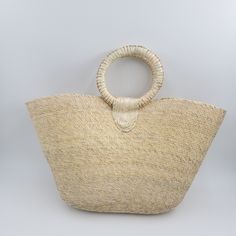 Meet you new summer bag. This large woven farmers market bag with handle is perfect to take to beach or to market. Its versatile and trendy. Measures 21" x 13" Add pompom and make it unique. ( Pompom shown in this picture is just sample not included with bag.) Handmade in Mexico. Bohemian Cream Beach Bag For Beach Season, Natural Palm Leaf Beach Bag For Vacation, Summer Jute Bag With Rolled Handles, Summer Beach Bag With Rolled Handles, Cream Straw Beach Bag For Summer, Bohemian Beach Bag In Natural Fiber For Vacation, Cream Bohemian Beach Bag For Summer, Cream Beach Bag For Vacation, Spring Vacation Beach Bag With Rolled Handles