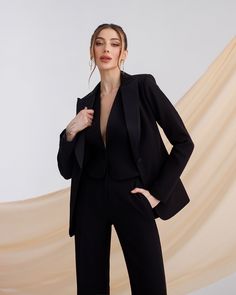 Three-piece pantsuit for women: straight leg pants with high rise, buttoned vest and lined blazer with satin lapel collar Please note suit measurements  Pants length inseam is 35.4 inches or 90 cm Pants length from waist 44 inches or 112 cm Sleeve length 24.4 inches or 62 cm Blazer length along the back 25 1/2 inches or 65 cm Vest length along the back 17.7 inches or 45 cm Our Women's Blazer Trouser Suit for office, business meetings, formal events and special occasions. Always trendy, classic and o good looking DETAILS -  straight leg pants -  high rise -  blazer is buttoned -  lined -  side pockets -  relaxed fit -  single breasted -  buttoned vest MATERIAL Premium quality suiting fabric, consists of viscose, elastane and polyester  SIZES The model in photos is wearing a size S Available Semi-formal Pantsuit With Lapel Collar, Single Breasted Structured Pantsuit For Business, Structured Single Breasted Pantsuit For Business, Single-breasted Structured Pantsuit For Business, Sleek Single-breasted Semi-formal Pantsuit, Chic Pantsuit With Button Closure And Lapel Collar, Semi-formal Sleek Single Breasted Pantsuit, Evening Tuxedo Suit With Button Closure, Evening Suits With Button Closure And Suit Collar