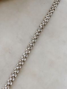 Beautiful clustered pearls and crystals on ribbon ties. We love this modern but classic design. Elegant Silver Bridal Belt For Wedding, Silver Adjustable Bridal Belt For Formal Occasions, Adjustable Silver Bridal Belt For Formal Occasions, Elegant Pearl White Jewelry With Rhinestones, Elegant Crystal Bridal Belt For Formal Occasions, Elegant Formal Bridal Belt, Elegant White Bridal Belt For Evening, Elegant Rhinestone Bridal Belt For Party, Elegant Champagne Wedding Jewelry