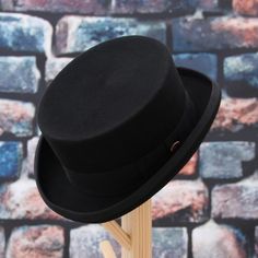 Ever since the end of the 18th century, top hats have been of historical importance and praiseworthy recognition value. Our elegant top hat comes in a lightweight version perfectly crafted from superior wool felt, which will accompany you on the most special days of your life. This elegant top hat is 4.3 inches high (11 cm).
Hat Details:

Material: Wool
Item Type: Top Hat

Sizes:

21.6 in / 55 cm
22.4 in / 57 cm
23.2 in / 59 cm
24.0 in / 61 cm Pork Pie Hats Men, Steampunk Cosplay Diy, Mens Felt Hat, Steampunk Gloves, Mens Fedora Hat, Steampunk Bag, Steampunk Shoes, Steampunk Pocket Watch, Women Skeleton