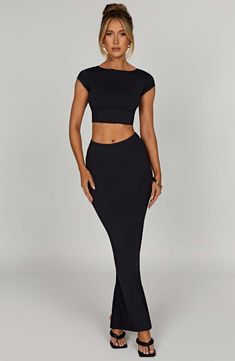 Double lined with a buttery soft, second skin feel, our brand new Anika crop top is one to wear on repeat. Serving stretch and snapping back to shape to contour your body, this high neck design has flattering cap sleeves and a sleek low scoop back. Pair with our Yasmin maxi for the basic look of your dreams. 



Colour: Black.

Buttery soft, premium modal fabric.

Double layered.

Second skin feel.

Moulds to your shape.

Moves with your body.

Soft and stretchy.

Cap sleeves.

High neck.

Low s Long Skirt Suits, Maxi Dress Sale, Streetwear Aesthetic, Sparkle Dress, Dresses By Length, Body Con Skirt, Solid Clothes, Formal Dresses Prom, On Repeat