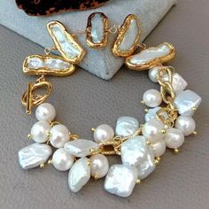 MIANIK Gems Info: Fresh water cultured pearl, white potato pearl and keshi Biwa pearl, good quality, high luster! Diameter: 8-9mm-10-11mm(pearl), 11x25mm(keshi pearl). length: 8"(bracelet). Clasp: Toggle clasp Keshi Pearl Bracelet, Gold Coin Jewelry, Biwa Pearls, Freshwater Pearl Jewelry, Matching Jewelry, Keshi Pearls, Coin Jewelry, Lovely Jewellery, Gold Plated Chains