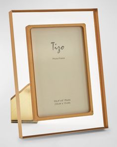 a wooden frame with the word'tigo'printed on it in silver and gold