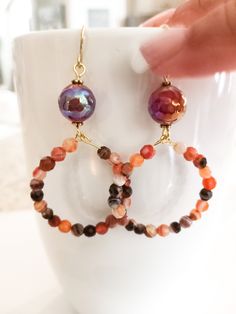 Nk Natural Carnelian faceted beaded Hoop earrings.  What is not to love, these are ready to wear for Fall.  Wear them on any occasion, but wear them for sure.  I have designed these earrings with that in mind, they are carefree in style and wear easily.  They are pretty lite and this is why I used small beads.  I do love the faceted bead, so they add that sparkle in each design.  These earring come with a gold tone ear wire and have a large sparkly shiny focal bead that blends super with the Carnelian smaller beads.  Love them! Gift Small Hoop Beaded Earrings With Faceted Beads, Small Hoop Beaded Earrings With Faceted Beads For Gift, Faceted Beaded Earrings With Round Beads As Gift, Faceted Round Beaded Earrings As Gift, Faceted Round Bead Earrings As Gift, Faceted Beaded Earrings For Gift, Round Faceted Beaded Earrings For Gifts, Small Hoop Earrings With Faceted Beads For Gift, Gift Round Faceted Beaded Earrings