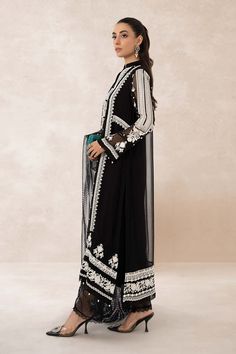 Traditional Black Shade Pakistani Salwar Kameez Embroidered Suit is a perfectly stitched masterpiece that will win everyone's hearts at the very first glance with its charm and elegance. The lavish contrast of black shade and premium quality of the fabric makes it an epitome of beauty and grace. Detailed Description: SKU: PB921 Detailing: Embroidery, Threads Color: Black Fabric: Net, Organza Design: Fully Embroidered dress Event: Festive, Party wear Black Palazzo Set With Traditional Drape For Eid, Bollywood Style Black Palazzo Set For Festive Season, Bollywood Style Black Palazzo Set For Festive Occasions, Festive Bollywood Style Black Palazzo Set, Black Anarkali Palazzo Set With Traditional Drape, Black Palazzo Set With Dupatta In Traditional Drape, Black Anarkali Palazzo Set, Black Bollywood Palazzo Set With Dupatta, Bollywood Style Black Palazzo Set For Eid