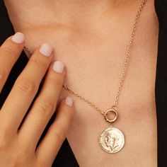 Our Majesty Coin Necklace features the distinguished profile of King George, a symbol of regal heritage and history. Crafted with precision, the Majesty Coin Necklace is perfect for those who appreciate historical significance combined with contemporary style. Wear it solo for a minimalist look or layer it with other pieces for a chic statement. Timeless 14k Gold Coin Pendant Necklace, Elegant 14k Yellow Gold Coin Necklace, Heirloom Brass Jewelry Tarnish Resistant, Classic Yellow Gold Jewelry With Clavicle Chain, Classic 14k Gold Clavicle Chain Jewelry, Tarnish Resistant Rose Gold Medallion Jewelry, Tarnish-resistant Rose Gold Medallion Jewelry, Tarnish Resistant Brass Medallion Jewelry, Luxury Gold Plated Tarnish Resistant Coin Necklace