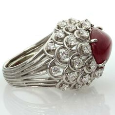 For Sale on 1stdibs - This captivating ring from David Webb features an open-design dome crown prong-set with an oval 11.0mm x 15.0mm cabochon ruby and surrounded by 36 sparkling Luxury Ruby Cabochon Diamond Ring, Luxury Ruby And Diamond Oval Cabochon Ring, Luxury Oval Cabochon Ruby Ring, Luxury Ruby Ring With Oval Cabochon Diamond, Luxury Silver Ruby Cabochon Ring, Luxury Ruby Ring Oval Cabochon Polished Finish, Luxury Ruby Ring Oval Cabochon With Polished Finish, Luxury Ruby Ring With Oval Cabochon And Polished Finish, Formal Ruby Ring With Diamond And Oval Cabochon Shape