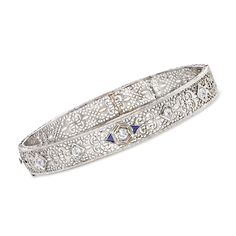 Ross-Simons - C. 1950 Vintage .50ct t. w. Diamond, .12ct t. w. Synthetic Sapphire Filigree Bangle Bracelet. 7". C. 1950. Achieving a look of elegance can be as simple as finishing off your outfit with an ornate bracelet. From our Estate collection, this Retro-era bangle is crafted of filigree openwork in 14kt white gold and sparked by .50 ct. t. w. round Old European-cut diamonds and .12 ct. t. w. trillion-cut synthetic sapphires. Hinged with a figure 8 safety. Box clasp, synthetic sapphire and Vintage White Gold Hand-set Bracelets, Vintage Diamond Bracelet With Single Cut Diamonds For Wedding, Vintage Diamond Bracelet With Hand Set For Formal Occasions, Vintage White Gold Diamond Bracelet, Vintage Formal Diamond Bracelet With Hand Set, Vintage Platinum Bracelets With Diamond Accents, Vintage Hand Set Diamond Bracelet For Formal Occasions, Vintage Bracelets With Single Cut Diamonds For Anniversary, Vintage White Gold Bracelet With Single Cut Diamonds