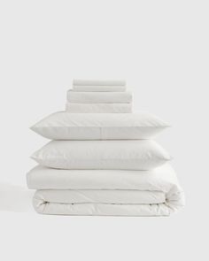 white pillows stacked on top of each other