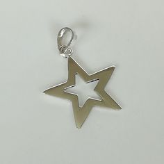 ▪︎ Sterling silver star frame pendant. ▪︎ Size: 18 x 18 mm ▪︎ Can be used as a charm for necklaces, bracelet, keychains, zip pullers etc ▪︎ This pendant is handmade with hypoallergenic sterling silver and marked with a 925 silver stamp. ▪︎ Please note: This pendant comes WITHOUT the chain, however, you can add a snake chain in the required length while making your selection. You can also opt to choose other kinds of chains and bracelet chains from my shop by visiting the links below. ▪︎ All jewe Symbolic Sterling Silver Star Charm Jewelry, Symbolic Sterling Silver Jewelry With Star Charm, Sterling Silver Star Charm Jewelry, Silver Dangle Charm Necklace With Star Charm, Symbolic Sterling Silver Star Jewelry, Symbolic Pendant Necklace With Star Charm, Symbolic Star Charm Pendant Necklace, Silver Star-shaped Jewelry With Dangling Charms, Silver Round Pendant Jewelry With Star Charm