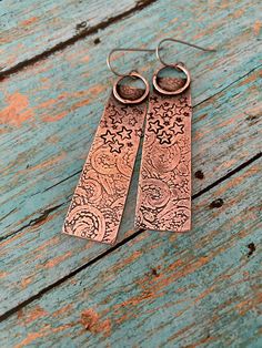 Rustic Hammered Copper Earrings|Handmade Copper Earrings|Antiqued Texturized Artisan Earrings|Boho, Hippie Dangle Earrings Lovely and lightweight bare copper rustic dangle earrings (pics 1-4), hand sawn, texturized, polished and oxidized. Ear wires made of pure commercial grade A hypo-allergenic Titanium, 20 gauge, excellent for sensitive ears. Length is approximately 2  1/4 " (58 mm) and width is slightly over  1/2 " (14 mm) at the widest point. Antiqued, hand-polished for warm aged look and se Artisan Etched Dangle Earrings, Artistic Silver-colored Copper Earrings, Artistic Silver Copper Earrings, Festival Silver Copper Earrings, Etched Metal Dangle Earrings, Bohemian Etched Drop Earrings, Bohemian Drop Earrings With Etched Details, Bohemian Etched Dangle Earrings, Vintage Etched Dangle Earrings