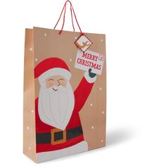 a paper bag with a santa clause holding a sign that says merry christmas on it