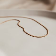 Add a touch of sophistication with our sleek Aria box chain necklace. Super versatile this chain is perfect for the single necklace minimal but elegant look or add to your necklace stack for a bit more texture. Everyday Rose Gold Snake Chain Necklace, Delicate Box Chain Jewelry For Everyday, Everyday Rose Gold Curb Chain Necklace, Everyday Rose Gold Necklace With Curb Chain, Minimalist Rose Gold Jewelry With Box Chain, Everyday Rose Gold Chain Necklace, Everyday Rose Gold Necklace With Box Chain, Everyday Rose Gold Box Chain Necklace, Delicate Rose Gold Box Chain Necklace