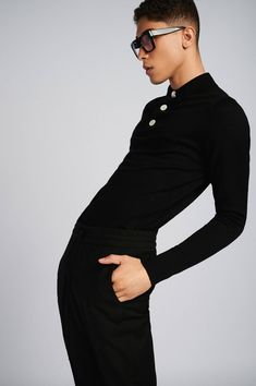 Overview:Made from 100% extra-fine merino wool. This black long-sleeve polo shirt features 3 shell pearl buttons Highlights:- Black Merino Wool- Concealed placket- Ribbed collar, cuffs, and waistband- 3 shell buttons- Gender-neutral Size & fitting:- Model measures: Height 1.86cm; Chest/Bust 93cm; Waist 77cm; Hip 93cm- Model wears a size M Info & Care:- Merinos Extrafine Wool 100%- Hand wash About the brand: At Mercader, we anticipate a movement in fashion on the impact of Seasonless, Genderless, Gender Free, Conscious Fashion, Long Sleeve Polo Shirt, Pearl Buttons, Long Sleeve Polo, Ethical Fashion, Polo Shirts, Classic Shirt, Black Long Sleeve