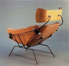 the chair is made out of wood and has metal legs, which are attached to each other