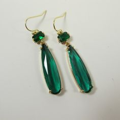 Emerald Green Crystal Earrings, Emerald Green Teardrop Earrings, Sparkly Dangle Earrings, Green Wedding Jewelry, Green Statement Earrings. These beautiful and elegant drop earrings made with high quality, sparkly 24k gold framed, faceted green glass crystals hang from tarnish resistant French ear hooks. These earrings are classic and elegant. Will make an excellent gift for yourself or friends. Measurements: The total length from the top of the hook to bottom - 2.16 inches (55 mm) approximately. Green Wedding Jewelry, Green Statement Earrings, Emerald Green Crystal, Earrings Emerald, Reflecting Light, Earrings Green, Green Crystal, Everyday Earrings, Green Crystals