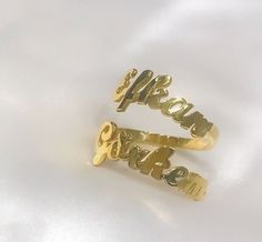 This 14K solid gold double name ring  is a  meaningful gift for your loved one or a special treat just for yourself . You can buy this personalized two name ring as an engagement ring which includes couple's names . This affordable and thoughtful custom multiple name ring gift will surely be treasured by your loved one.   *FEATURES Material : 14 K Solid Gold  Colour : gold * PACKAGING Jewels will be sent nicely wrapped and packed in a box! If specific goods are intended as gifts, please leave us a note. We'll use a special box separately and include a gift card for you! The most unique jewelry you can find, a perfect gift for you and your loved one ... Birthday Gift , Wedding Gift , Gift For Love ,  Bridesmaid Gift , Anniversary Gift , Mother's Day Gift , Graduation Gift * SHIPPING DETAILS Customized Nameplate Rings For Anniversary, Yellow Gold Custom Name Promise Rings, Customized Gold Engraved Promise Ring, Customizable 14k Gold Rings For Personalized Gifts, Yellow Gold Promise Rings With Custom Name, Gold Promise Ring With Name, Custom Name 14k Gold Rings For Personalized Gift, Personalized 14k Gold Rings With Custom Name, Customizable Yellow Gold Ring For Personalized Gift