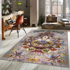 a colorful rug in the middle of a room