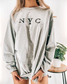 Your new favorite t-shirt is made with lots of care!  At your own home or when you stay comfortable, stay stylish and warm with this cozy crewneck sweatshirt. The crewneck is unisex, 100% cotton, and preshrunk. ✨SHIPPING✨ ∙ FREE SHIPPING FOR ALL ORDERS $100+ (in the U.S.) ∙ WORLDWIDE SHIPPING ∙ Orders are usually processed and shipped out in 5-7 business days, but in some cases, it may take up to 2 weeks. ✨DIMENSIONS✨ Reference the last photo for the size chart. ✨CARE INSTRUCTIONS✨ ∙ Wash inside-out ∙ Cold setting ∙ Hang to dry ∙ Avoid direct heat or iron * MORE FROM US * (Apparel, Jewelry, Tote Bags, Stickers, etc.) ➡️ https://www.etsy.com/shop/DahiCo La Shirt, Los Angeles City, Shipping Orders, Shirt Top, Long Sleeve T Shirt, Crewneck Sweatshirt, Sweat Shirt, Graphic Tee, Inside Out