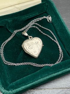 Vintage  silver locket for women. Double sided silver locket with hand engraved back and front.  Silver heart locket. Silver pendant . Silver necklace for women.       Vintage circa 70s. Condition: necklace in perfect vintage condition. Materials: Silver. Rhodium plated silver chain.  Measure: chain 16"/ 41 cm,   Locket  0.7" x 0.7"/  1.8 x 1.8 cm. Package: gift wrap available, please specify when ordering. Delivery: your order will be send by Royal Mail with tracking and signed in 1-2 working d Silver Locket Jewelry For Mother's Day, Mother's Day Silver Locket Jewelry, Etched Pendant Locket Necklace As A Gift, Silver Etched Heart Pendant Jewelry, Silver Etched Necklace For Valentine's Day, Valentine's Day Silver Etched Necklace, Antique Locket Jewelry For Anniversary Gift, Victorian Etched Locket Necklace For Gift, Victorian Etched Locket Necklace As Gift