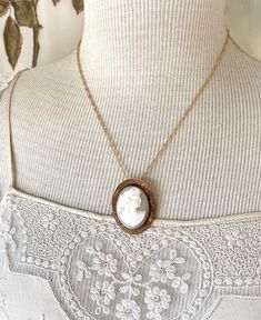 "This lovely antique, gray and white shell cameo, still a brooch, also has a \"no show\" bail that I installed.  If the chain is removed, it can then be worn as a brooch. The brooch itself measures  1 1/2\" by 1 1/8\". The engraving around the rim of the bezel is beautiful.  I do not know the gold content of this piece. Nor am I a cameo expert.  Please check the pictures closely. The gold plated chain is 18\" long. I work with antique and vintage parts. Some may show signs of wear or age. Please Woman Profile, Carved Necklace, Necklace Woman, Victorian Pendants, Female Profile, Assemblage Jewelry, Antique Buttons, Button Jewelry, Pendant Gold