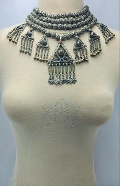 *The silver tribal necklace is one of the most engaging jewelry pieces we have in our collection. This semi-silver tribal necklace is one of the most adored pieces in our collection. The pendants and silver drooping tassels with antique designs and glass stones. Above all the beaded multilayers make this tribal piece a worth admiring piece for our consumers. *Made up of the best quality of metal alloy this multilayer choker necklace takes us back to ancient times. The antiquity and grace of this Beaded Jewelry For Rituals And Festivals, Traditional Silver Beads Jewelry For Festival, Bohemian Beaded Temple Necklace For Festivals, Traditional One-of-a-kind Necklace For Festival, Bohemian Silver Beads Necklaces For Rituals, Bohemian Necklaces With Silver Beads For Rituals, Silver Beaded Necklaces With Jewels, Silver Beaded Jewelry For Festivals, Silver Beaded Festival Jewelry