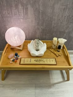 a wooden tray with various items on it